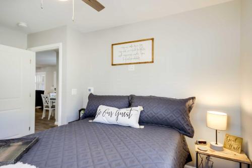 a bedroom with a gray bed with a pillow on it at Step-Free Home with Fire Pit - 3 Miles to USC! in Columbia