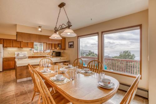 a kitchen and dining room with a table and chairs at Hillside House in Lincoln City