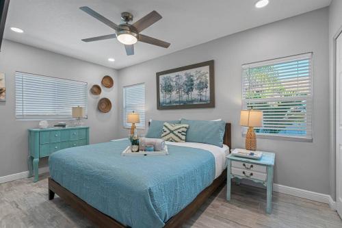 a bedroom with a bed and a ceiling fan at Downtown Dunedin Gem, Fully Renovated #2 in Dunedin