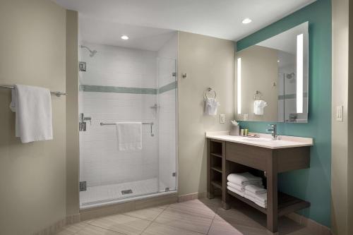 a bathroom with a sink and a shower at Hilton Grand Vacations Club Ocean 22 Myrtle Beach in Myrtle Beach