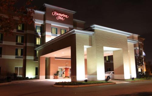 a hotel with a sign on the front of it at Hampton Inn Hampton-Newport News in Hampton