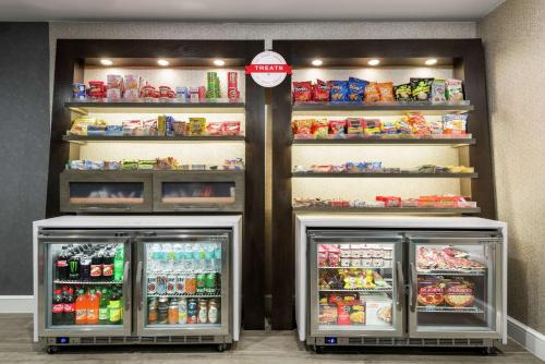 two refrigerators in a store with drinks and food at Hampton Inn & Suites Tampa Ybor City Downtown in Tampa