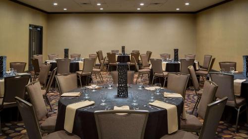 a conference room with a long table and chairs at Embassy Suites by Hilton Dallas-Love Field in Dallas