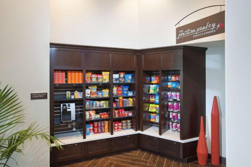 a grocery store with a vending machine filled with drinks at Hilton Garden Inn Burbank Los Angeles in Burbank