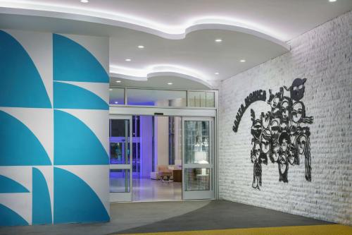 a lobby with a painting on the wall at Hampton Inn & Suites Santa Monica in Los Angeles