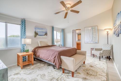 a bedroom with a bed and a ceiling fan at Nigh Tides in Yachats