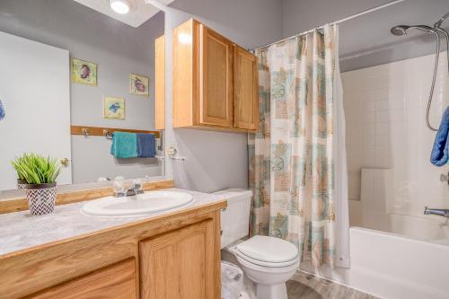 a bathroom with a sink and a toilet and a shower at Nigh Tides in Yachats