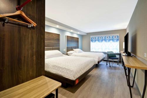 Ένα ή περισσότερα κρεβάτια σε δωμάτιο στο Tru By Hilton Chicopee Springfield