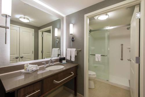 a bathroom with a sink and a shower and a toilet at Homewood Suites by Hilton Boston Marlborough in Berlin