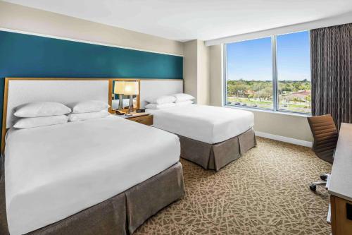 Ένα ή περισσότερα κρεβάτια σε δωμάτιο στο Hilton Miami Dadeland