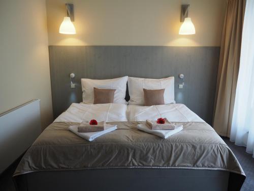 Postel nebo postele na pokoji v ubytování Hotel Výpřež - Děčín