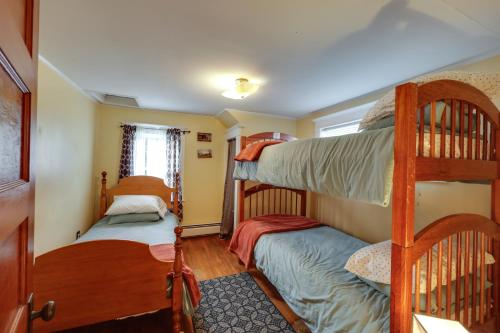 a room with two bunk beds in a house at Oceanfront Milbridge Getaway with Deck and Views! in Milbridge