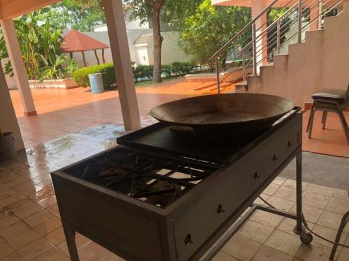 a grill with a pan on top of a stove at Beautiful Mountin Cabin/Pool/FirePit/Wifi/Parking in Monterrey