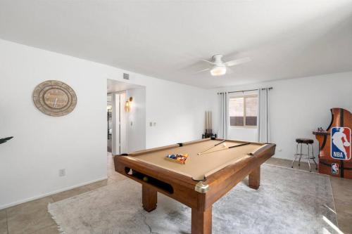 a living room with a pool table in it at Gilbert Getaway - pool+games+pool table in Gilbert
