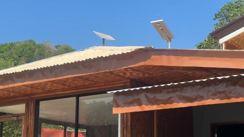 awning on the side of a building with a street light at Gratum Beach Resort in Dapitan