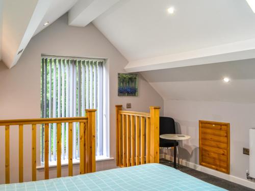 a bedroom with a bed and a balcony at Stoney Wall-uk45045 in Greenhead