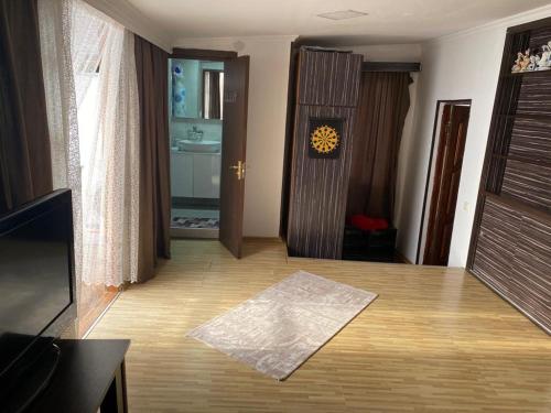 an empty living room with a door and a bathroom at House in Old Batumi in Batumi