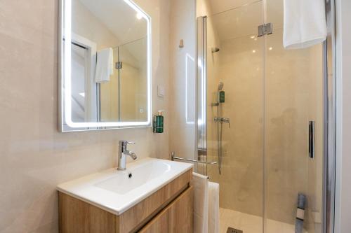 a bathroom with a sink and a shower at Boutique Room Montijo in Montijo