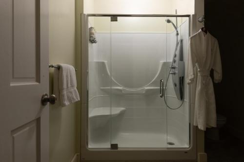 a shower with a glass door in a bathroom at Carlisle House Bed and Breakfast in Carlisle