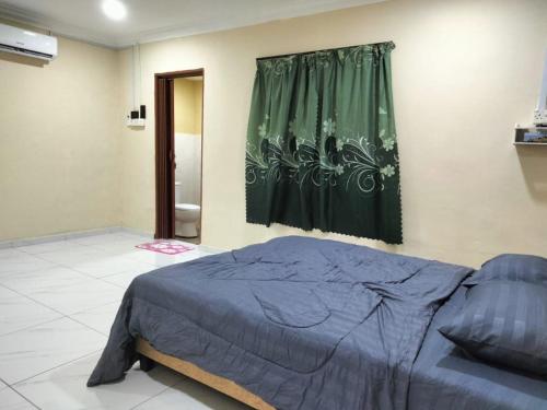Katil atau katil-katil dalam bilik di Homestay de Pernu