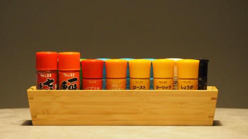 a wooden crate with a bunch of different colored candles at ALFACIO RESORT STAY ITOSHIMA in Itoshima