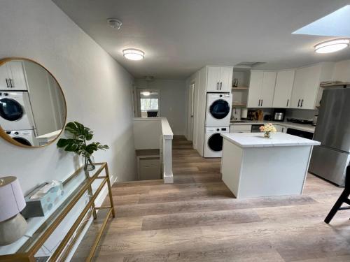 a kitchen with white cabinets and a white counter top at Tacoma 2 bedrooms 1 baths sleep 5 with compact kitchen in Tacoma