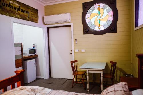 a room with a table and a clock on the wall at True Blue One in Sheffield