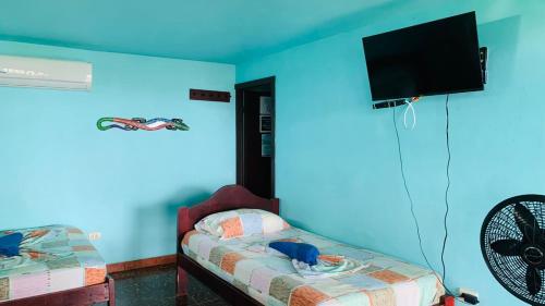 TV a/nebo společenská místnost v ubytování Hotel Cabinas Mar Y Cielo