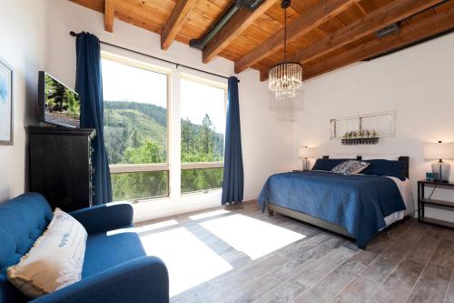 a bedroom with a bed and a large window at 846 County Rd 207 in Durango