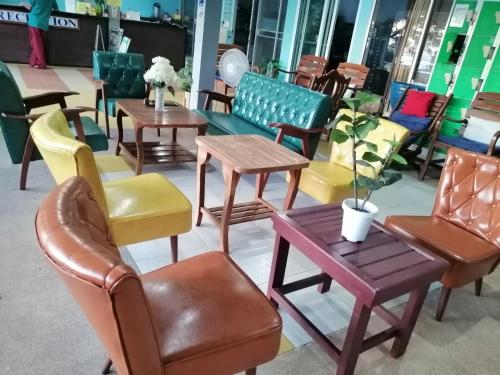 a group of chairs and tables in a store at Phi Phi View Point Resort in Phi Phi Don