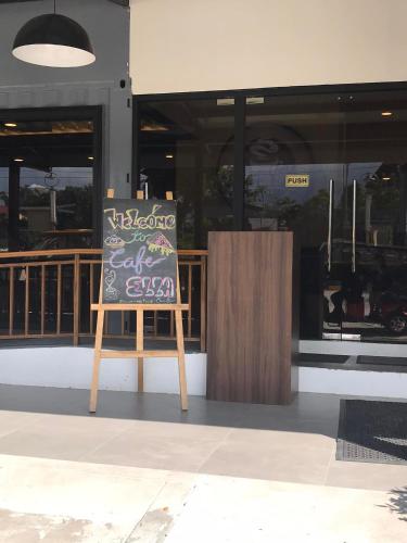 a chalkboard sign sitting in front of a building at Aurora Villas and Cabin Resort in Clark