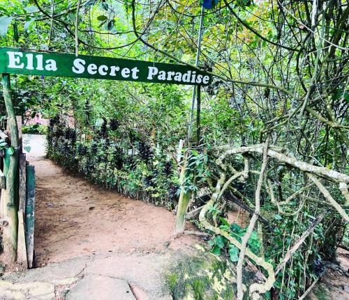 a sign that reads elka secret paradise on a trail at Ella Secret Paradise in Ella