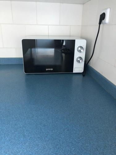 a microwave sitting on a counter in a bathroom at Apartment 7 in Izola