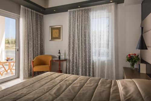 Ένα ή περισσότερα κρεβάτια σε δωμάτιο στο Lito Beach Hotel 