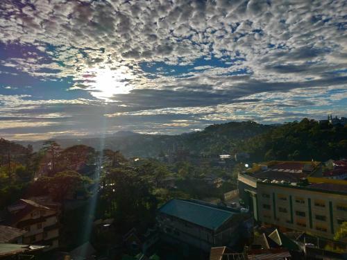 a view of a city under a cloudy sky at EMILIEZ PLACE in Baguio