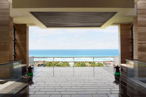 a view of the ocean from the lobby of a hotel at The Ritz-Carlton Bali in Nusa Dua