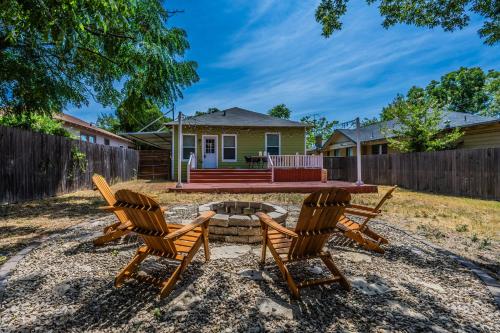 a backyard with two chairs and a fire pit at Charming Craftsman close by Bishop Arts & Downtown in Dallas