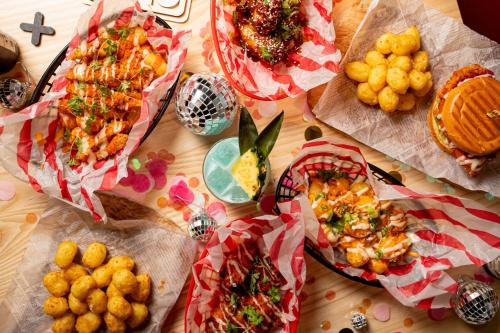 a table with many different types of food on it at Moxy Manchester City in Manchester