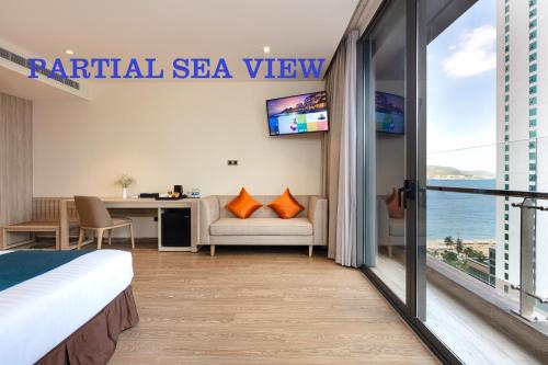 a hotel room with a view of the ocean at The Art Nest Hotel Nha Trang in Nha Trang