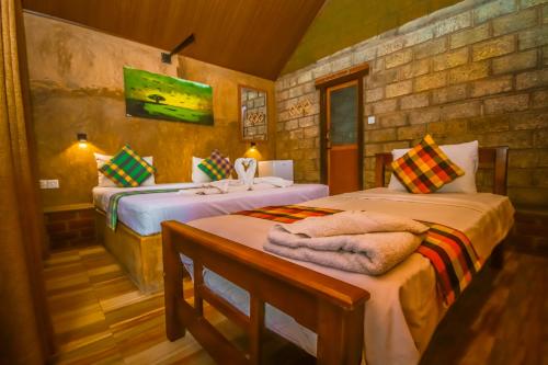 Postel nebo postele na pokoji v ubytování Negombo The Nature Villa and Cabanas