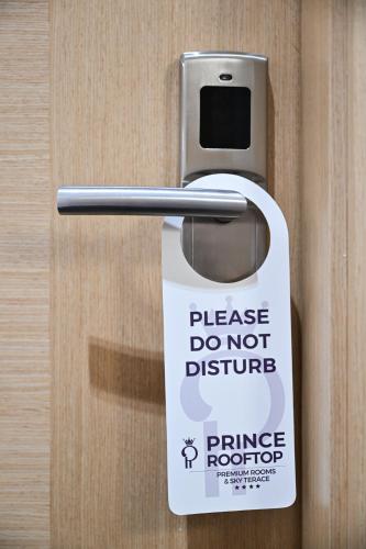 a do not disturb sign on a door handle at Prince Rooftop in Belgrade