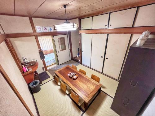 an overhead view of a dining room with a table and chairs at Bighem Maison in Izumi-Sano