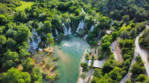 an aerial view of a waterfall and a river at Apartman Selma in Mostar