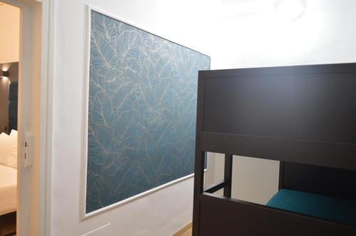 Ein Bett oder Betten in einem Zimmer der Unterkunft Geometric Hermes Bianca