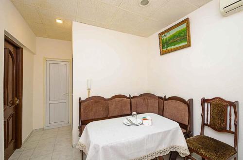 a dining room with a table and two chairs at Hotel AVE in Yerevan