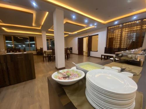 a room with a plate of food on a table at Lha-Zes in Leh