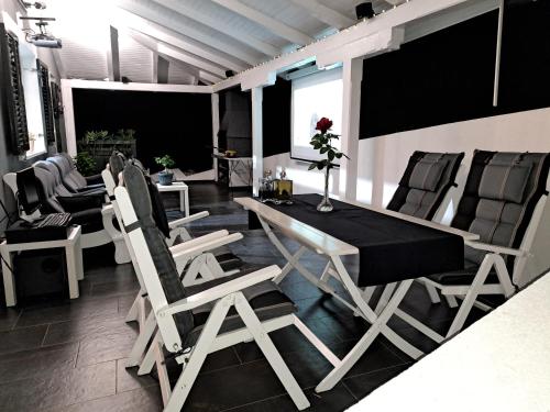 a dining room with chairs and a table and a table and chairsktop at Jakop Hof in Krapinske Toplice