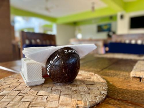 a chocolate egg sitting on top of a table at Zanoceanique Hotel in Matemwe