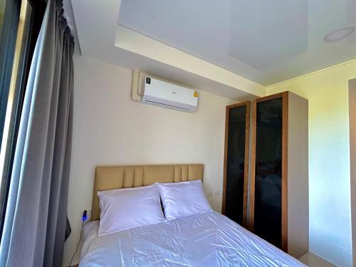 Postel nebo postele na pokoji v ubytování Maikhao Hillside-Sun Rising Space