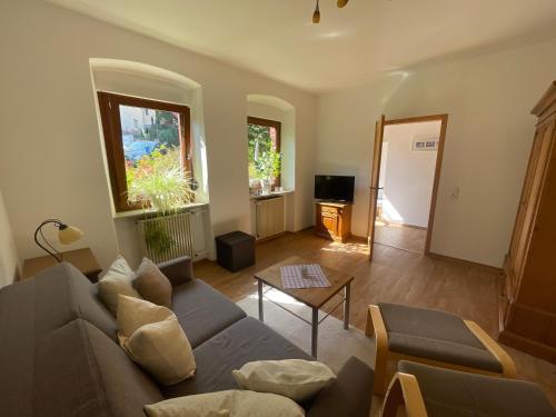 a living room with a couch and a table at Ferienwohnung Lilly in Eitelborn